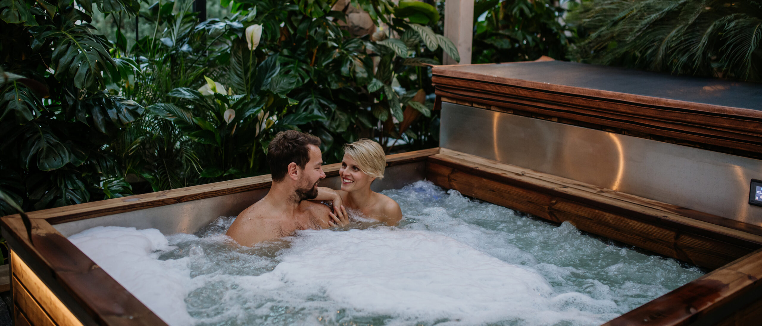 A romantic scene of a couple in a hot tub, showcasing the ideal setting for a hotel affiliate marketing campaign.