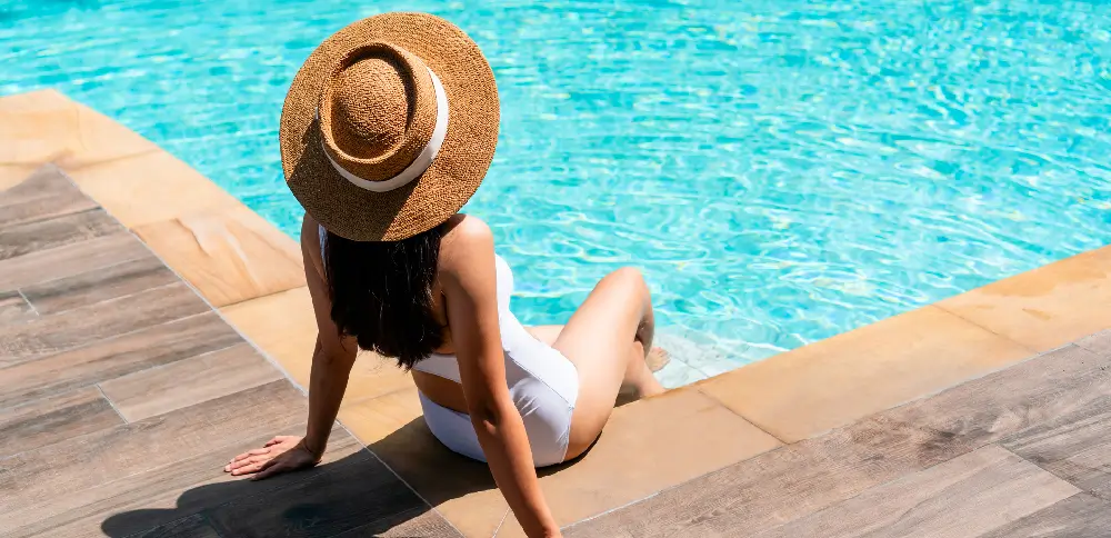 A posing at the pool showcasing a type of UGC for hotel marketing.