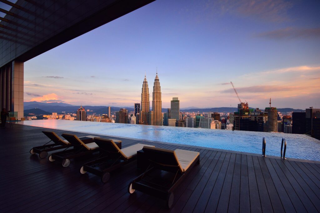 Luxurious infinity pool at Petronas Twin Towers, featuring panoramic city views, perfect for engaging hotel marketing on TikTok.