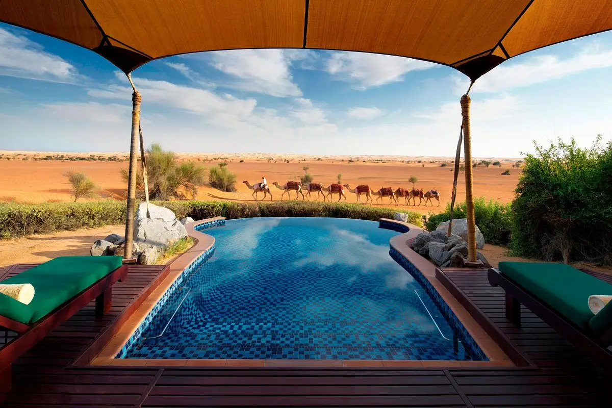 A stunning pool at Al Maha, one of the best desert hotels worldwide, offering breathtaking views of the desert.