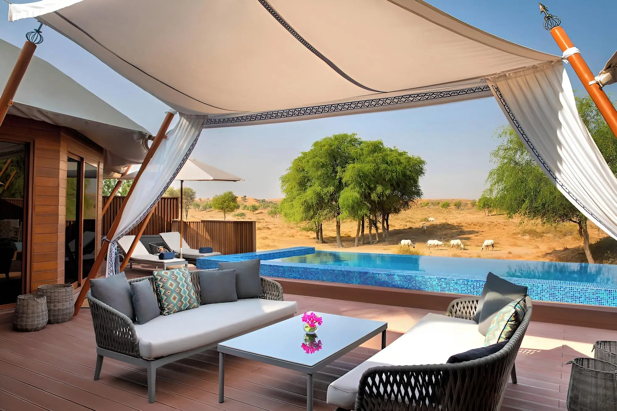 A luxurious tent with a pool and patio at The Ritz-Carlton Ras Al Khaimah, one of the best desert hotels worldwide.