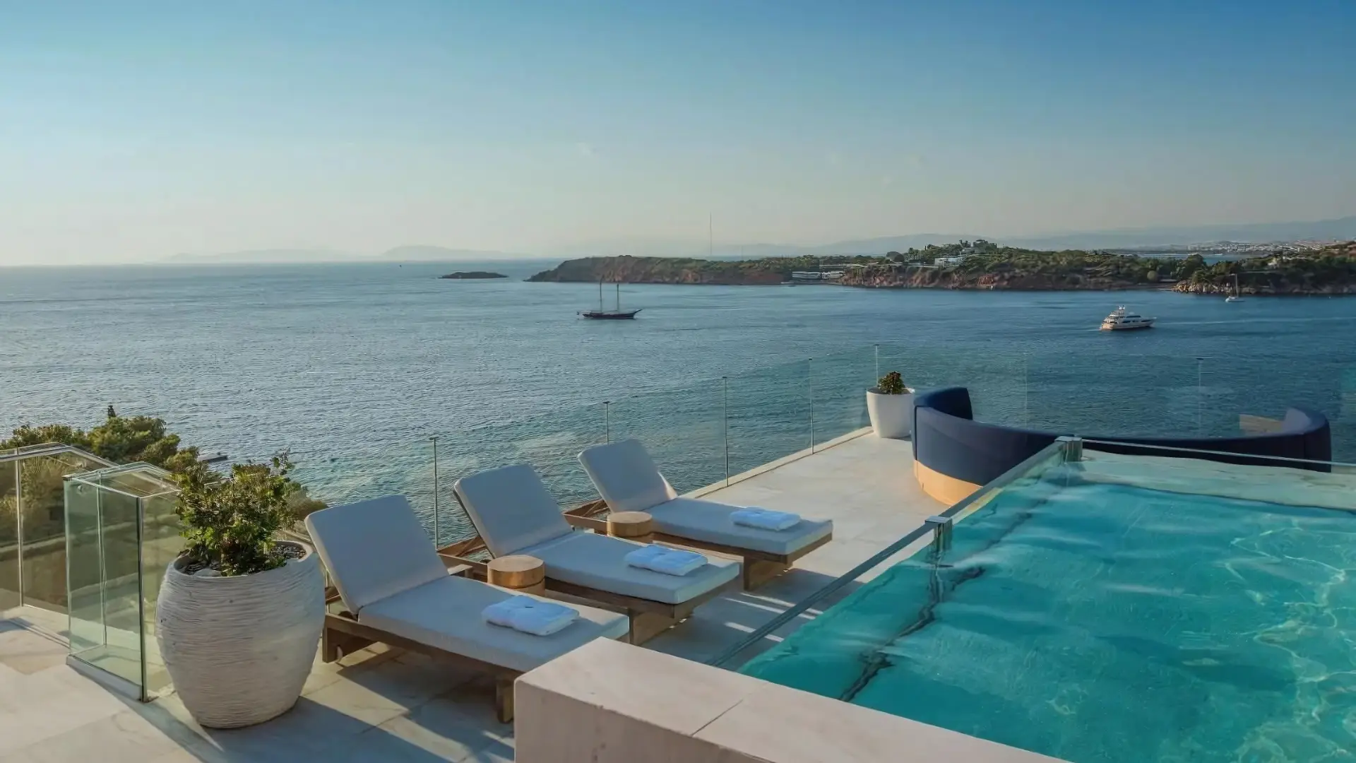 A stunning luxury villa at Four Seasons Astir Palace Hotel Athens, one of the best Four Seasons hotels in the world, with a breathtaking sea view.