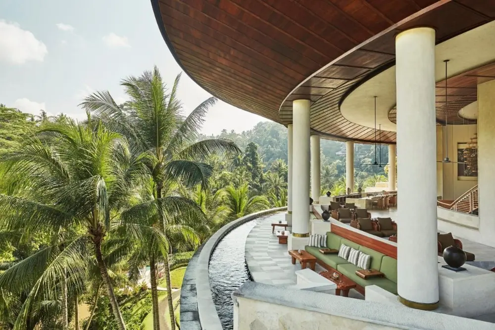 A stunning view of the large pool and lounge area at the Four Seasons Resort Bali at Sayan, one of the best Four Seasons hotels in the world.