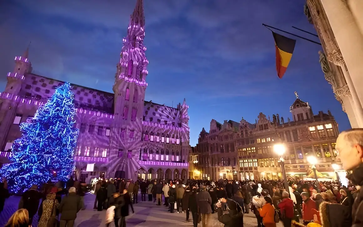 A light show over the building of Hotel metropole, one of the best hotels for new Year’s Eve in Brussels, getting all people together to watch it.