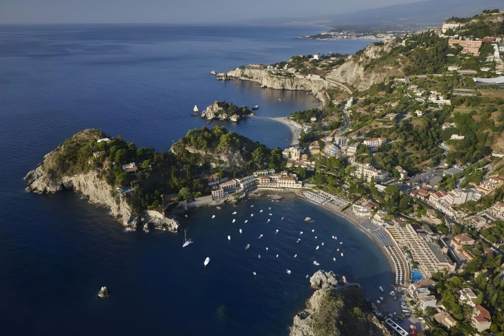 Aerial view of Italy's coast showcasing the stunning landscape near Belmond Villa Sant’Andrea, Taormina Mare one of the best hotels with private beaches in Sicily.