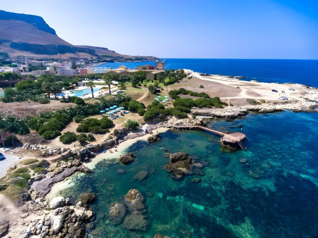 Scenic aerial perspective of La Tonnara di Bonagia resort, highlighting this hotel in Sicily with private beach.