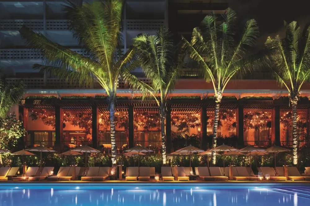 The pool at The Miami Beach EDITION, one of the best party hotels in Miami, offers a vibrant and inviting atmosphere.