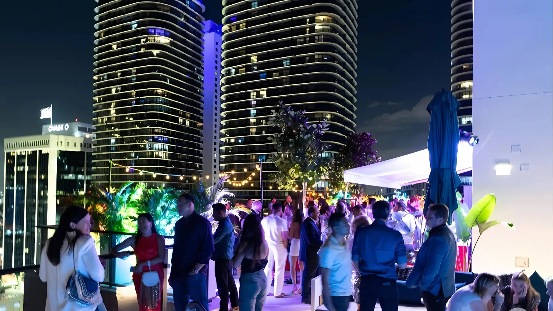 The outdoor patio at citizenM, one of the best party hotels in Miami, offers stunning views of the beach and a vibrant atmosphere for partying.