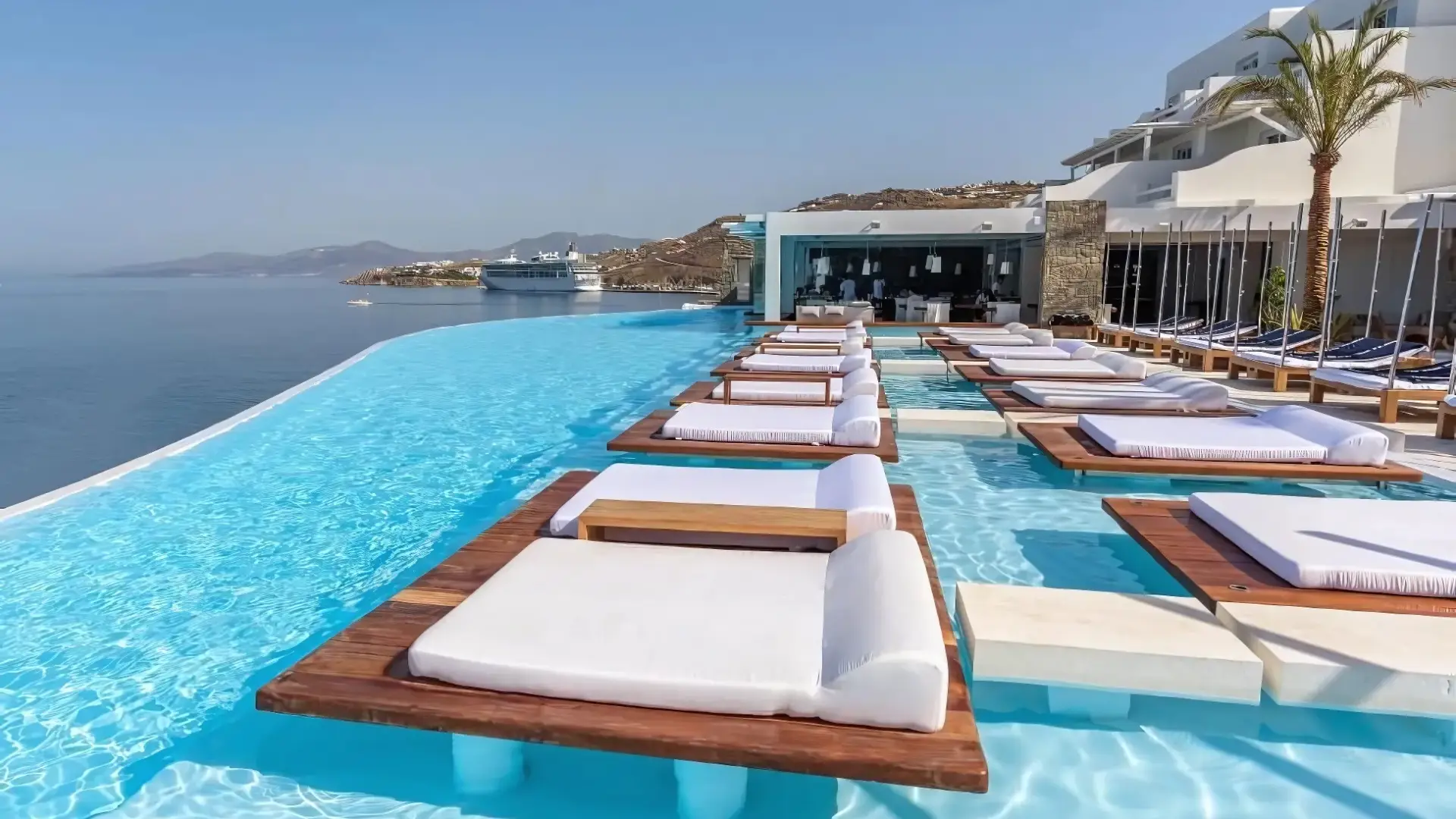 Infinity pool at Cavo Tagoo, one of the best hotels in Mykonos for party lovers, offering stunning views and relaxation.