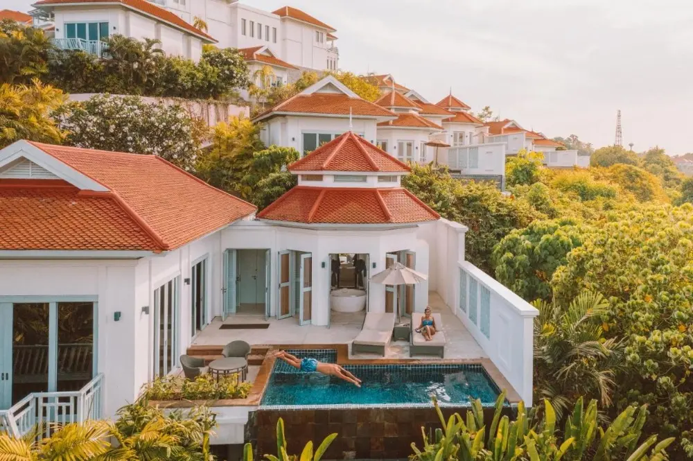 A luxurious swimming pool at Amatara Welleisure, one of the best resorts in Phuket for couples, showcasing its stunning atmosphere.