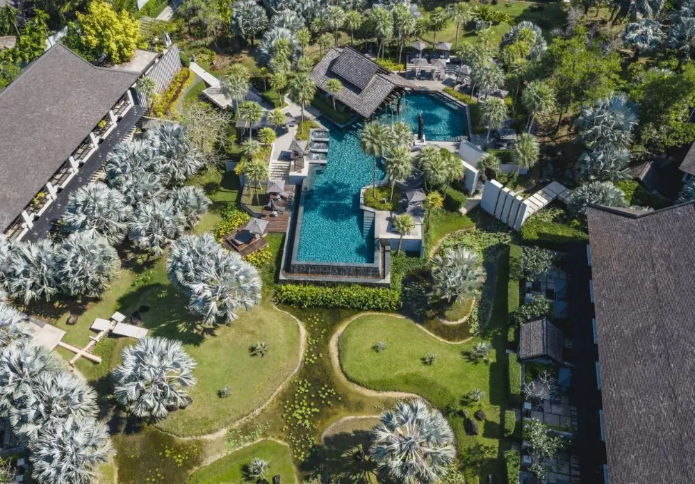 Aerial view showcasing a luxurious resort and pool, highlighting one of the best resorts in Phuket, Thailand.