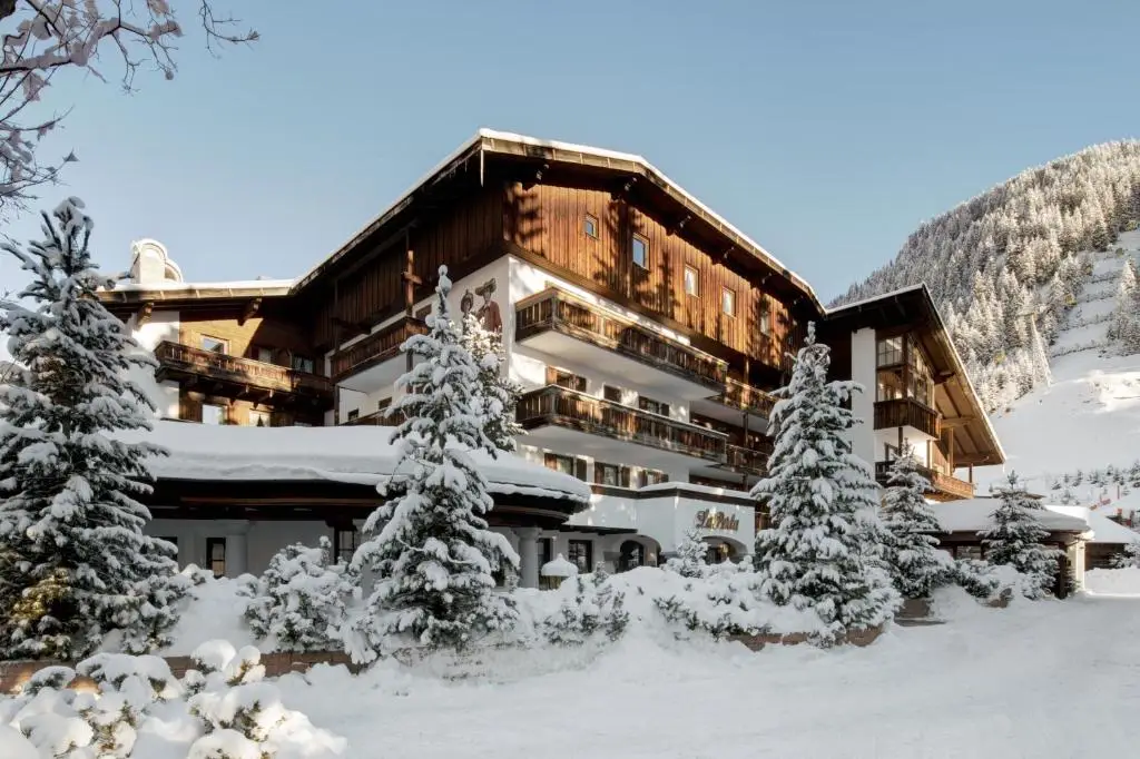 Discover Hotel La Perla, a charming hotel in the snowy mountains, perfect for skiing - one of the best ski hotels in Italy.