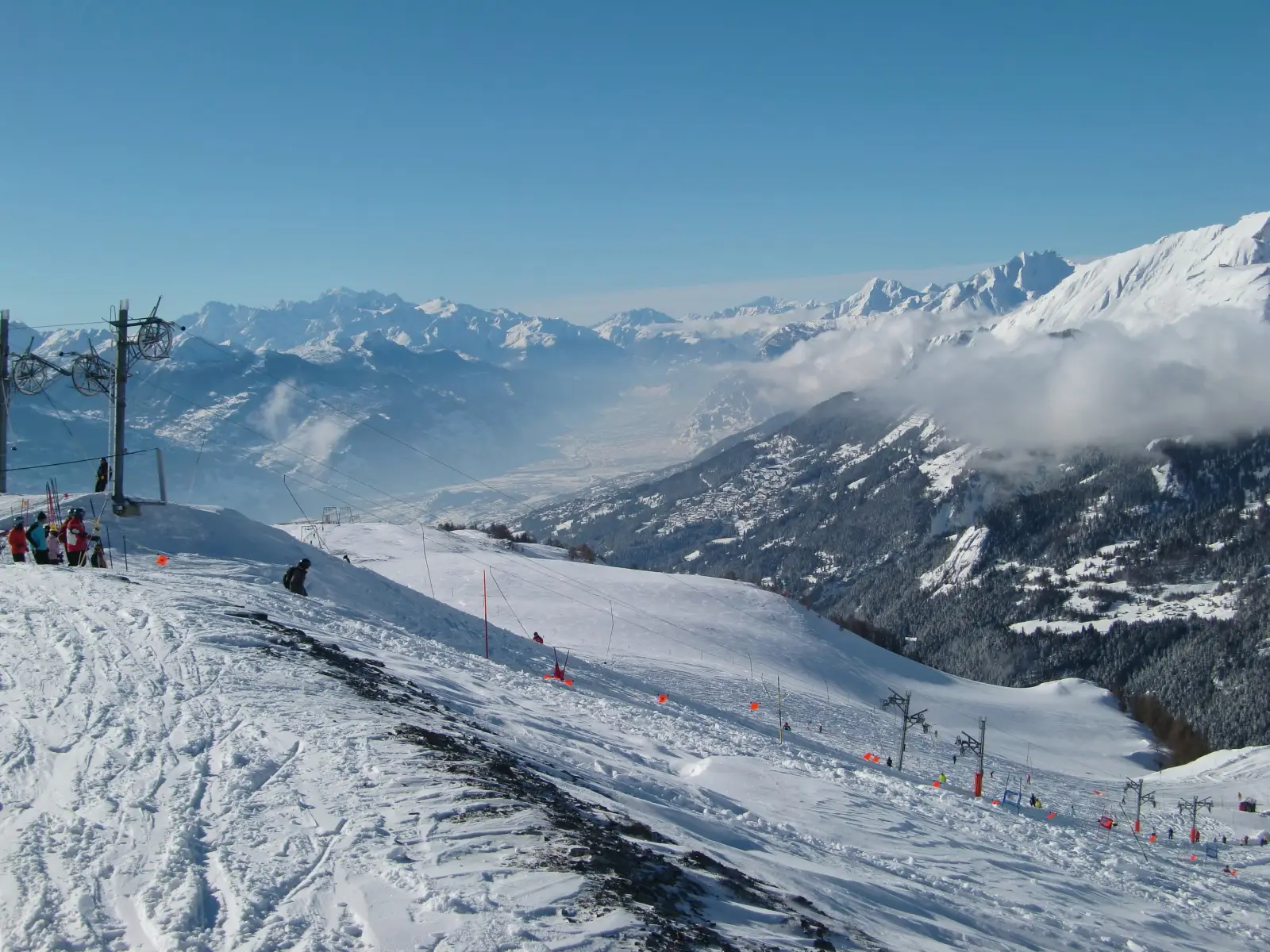 A snowy mountain range showcasing Crans-Montana, one of the best ski resorts in Switzerland, perfect for winter sports lovers.