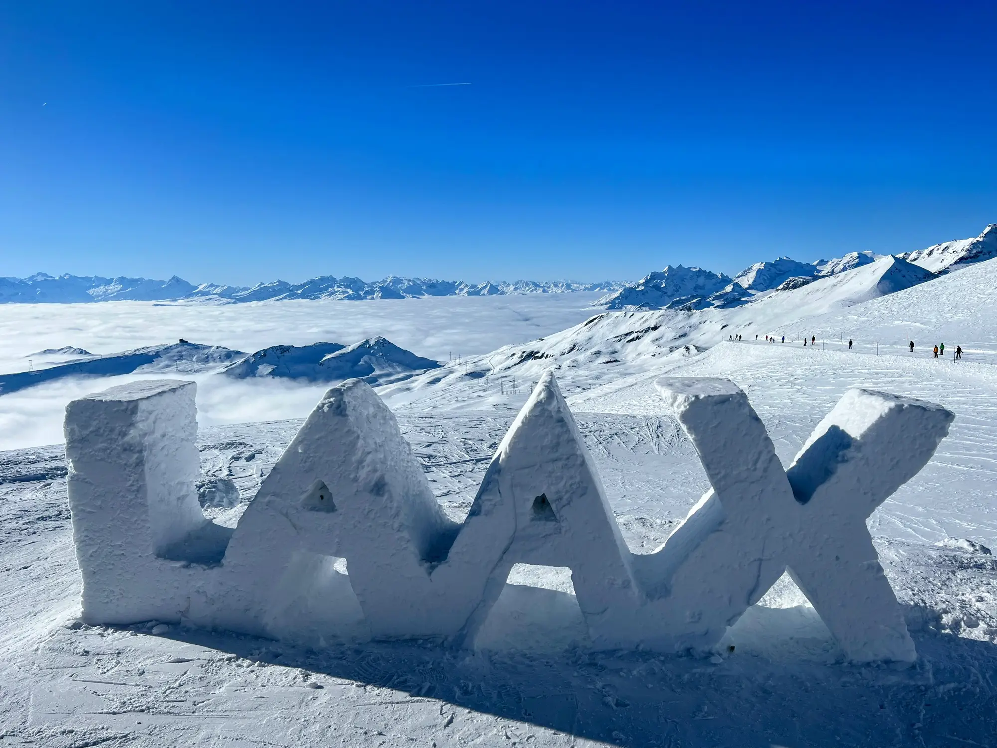 The word "lax" is formed from snow on a mountain at Laax, a top choice among the best ski resorts in Switzerland.