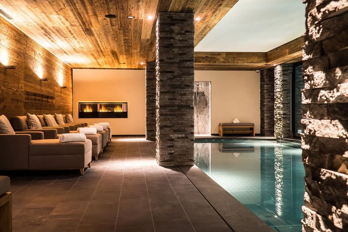 Indoor pool at The Capra Saas-Fee spa, one of the best snowboard hotels in Switzerland, perfect for relaxation.