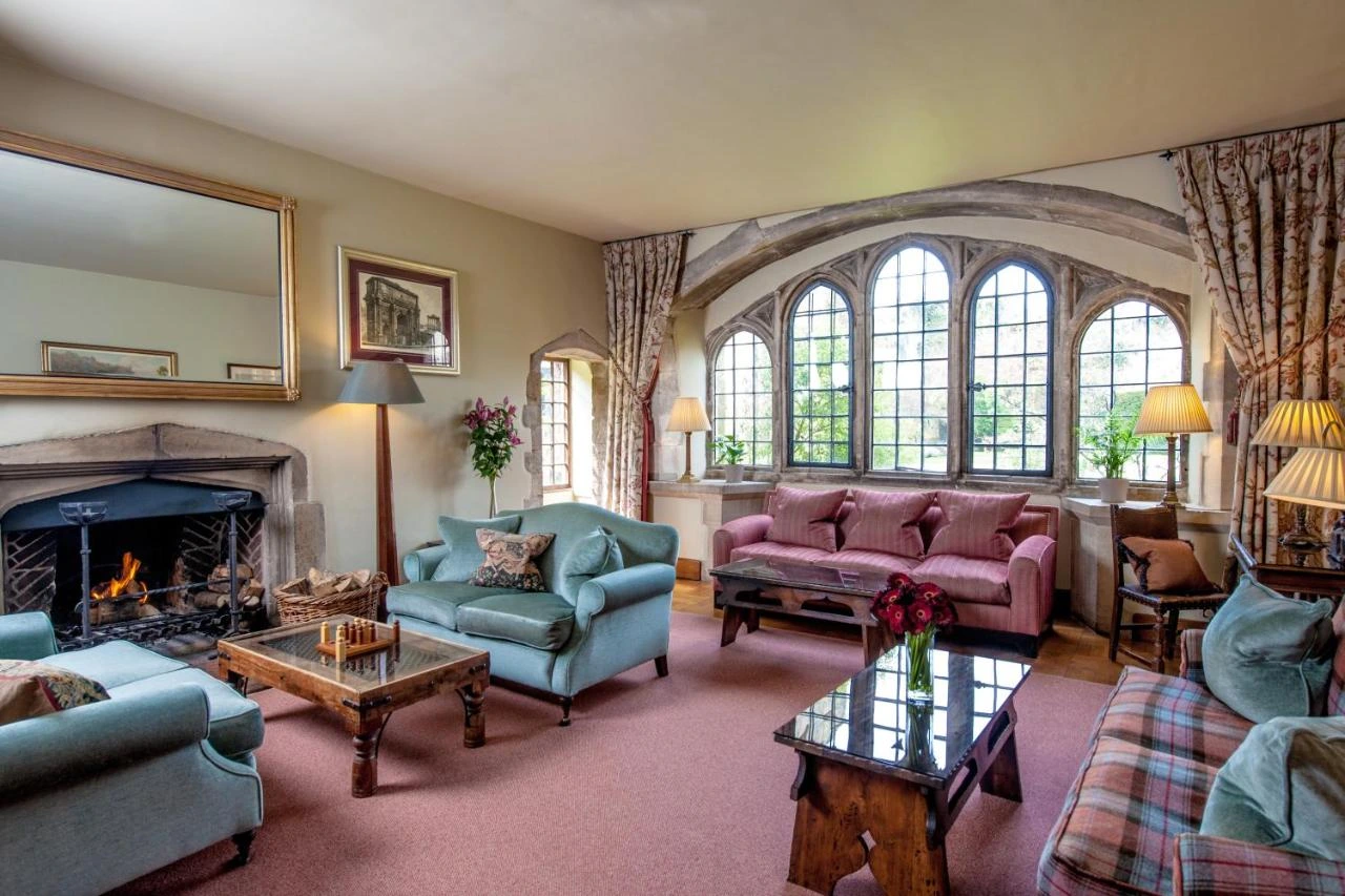 Stylish living room in Amberley Castle Hotel, one of the best castle hotels in the world, adorned with rich fabrics and elegant furnishings, perfect for relaxation.