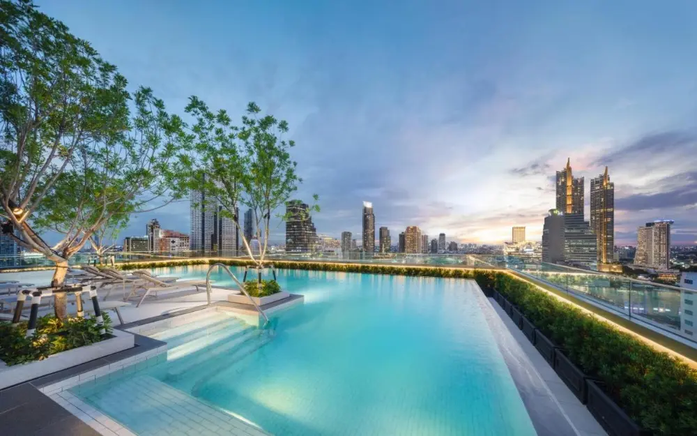 Rooftop pool at Grande Centre Point Surawong, one of the top choices among luxury hotels in Bangkok, Thailand, offering stunning views.