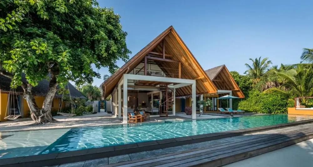 Stunning overwater villas at Patina Maldives, a luxury resort in Maldives Island, providing a luxurious escape in the idyllic island environment.