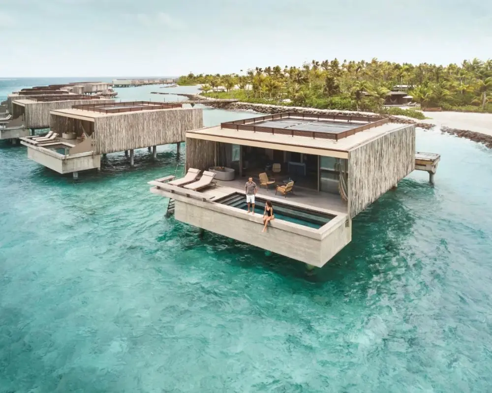 Stunning overwater villas at Patina Maldives, a luxury resort in Maldives Island, provide a luxurious escape in the idyllic island environment.