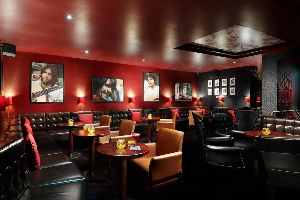 Restaurant at Hard Days Night Hotel, one of the best music-themed hotels worldwide, showcasing its music atmosphere with images of guitar players hanging on the walls.