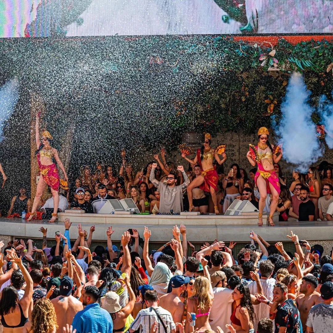 A lively crowd at The Venetian Resort, a party hotel in Las Vegas enjoying water spray.