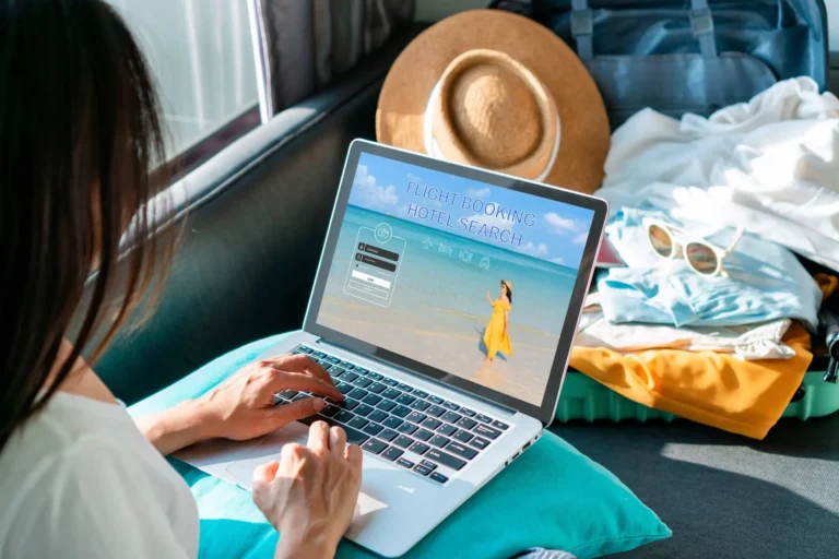 A woman working on a multichannel marketing strategy for hotels while travelling.